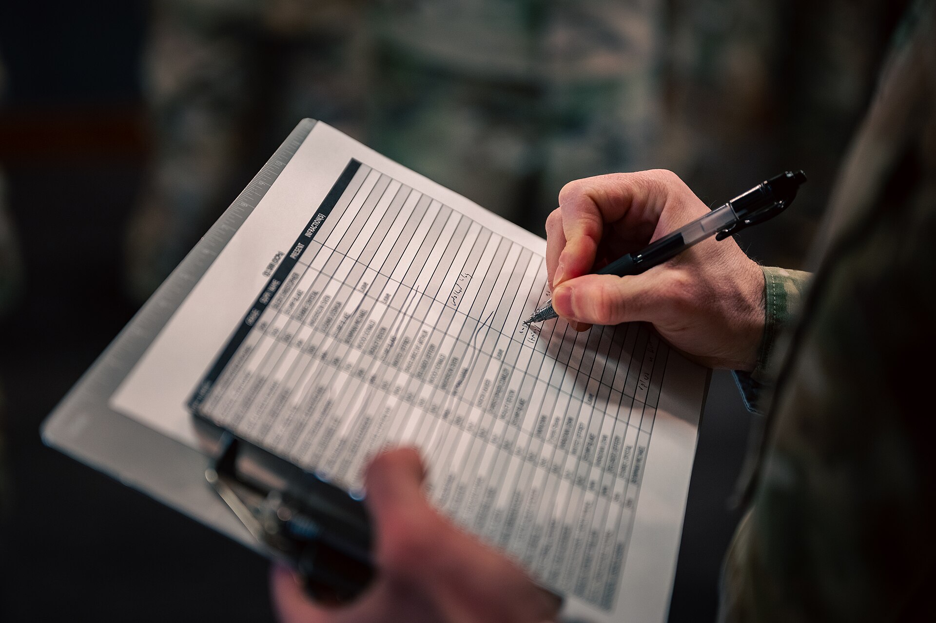 Driver completing medical certification paperwork on a clipboard