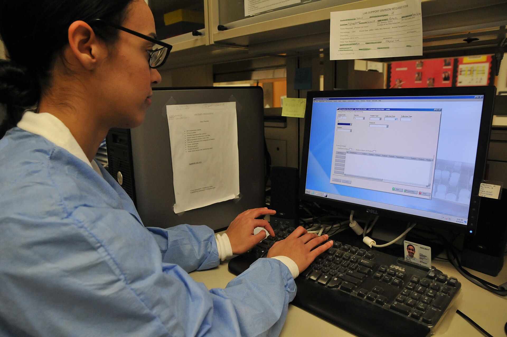 Laboratory technician processing test samples