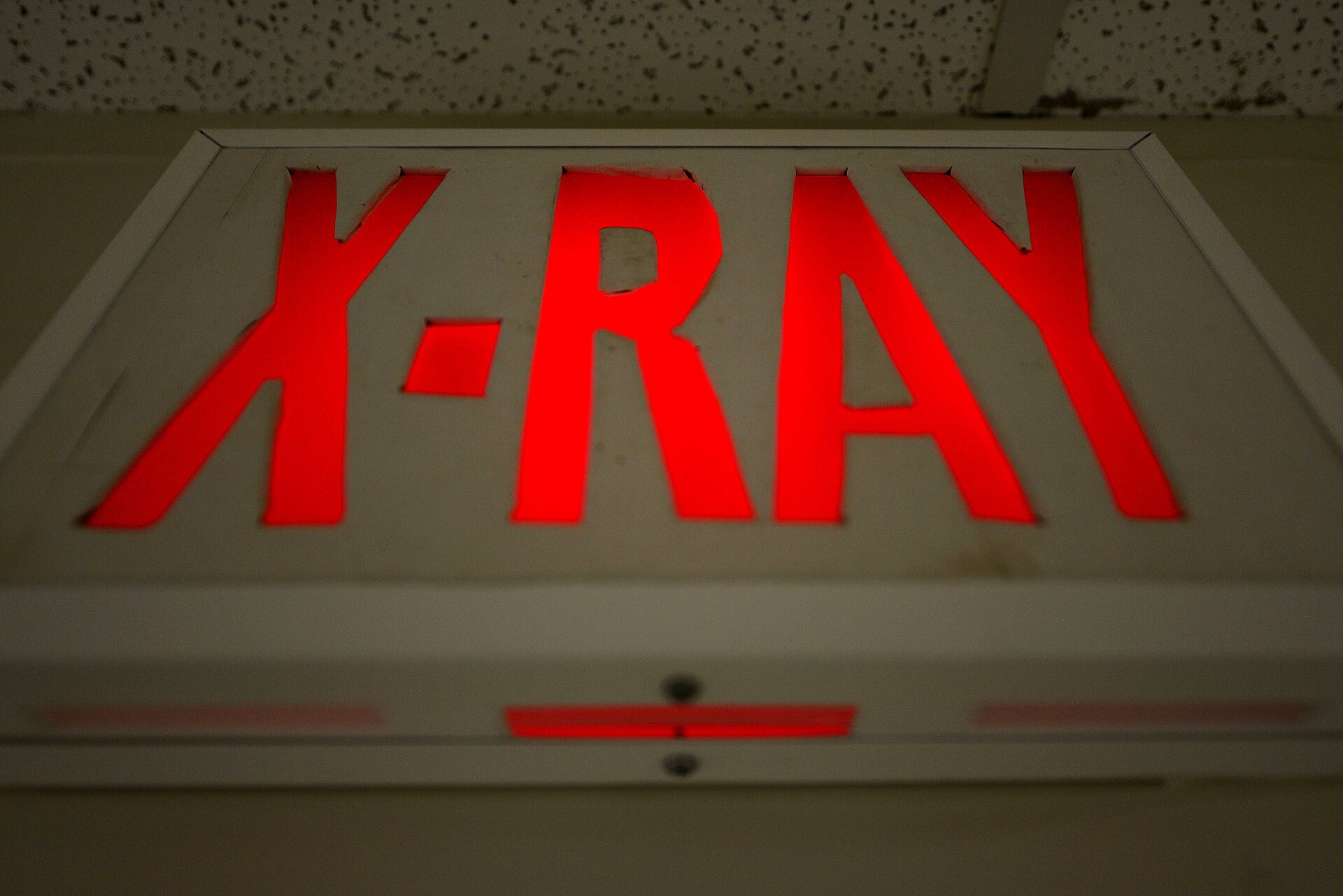 Illuminated X-ray sign outside a radiology room