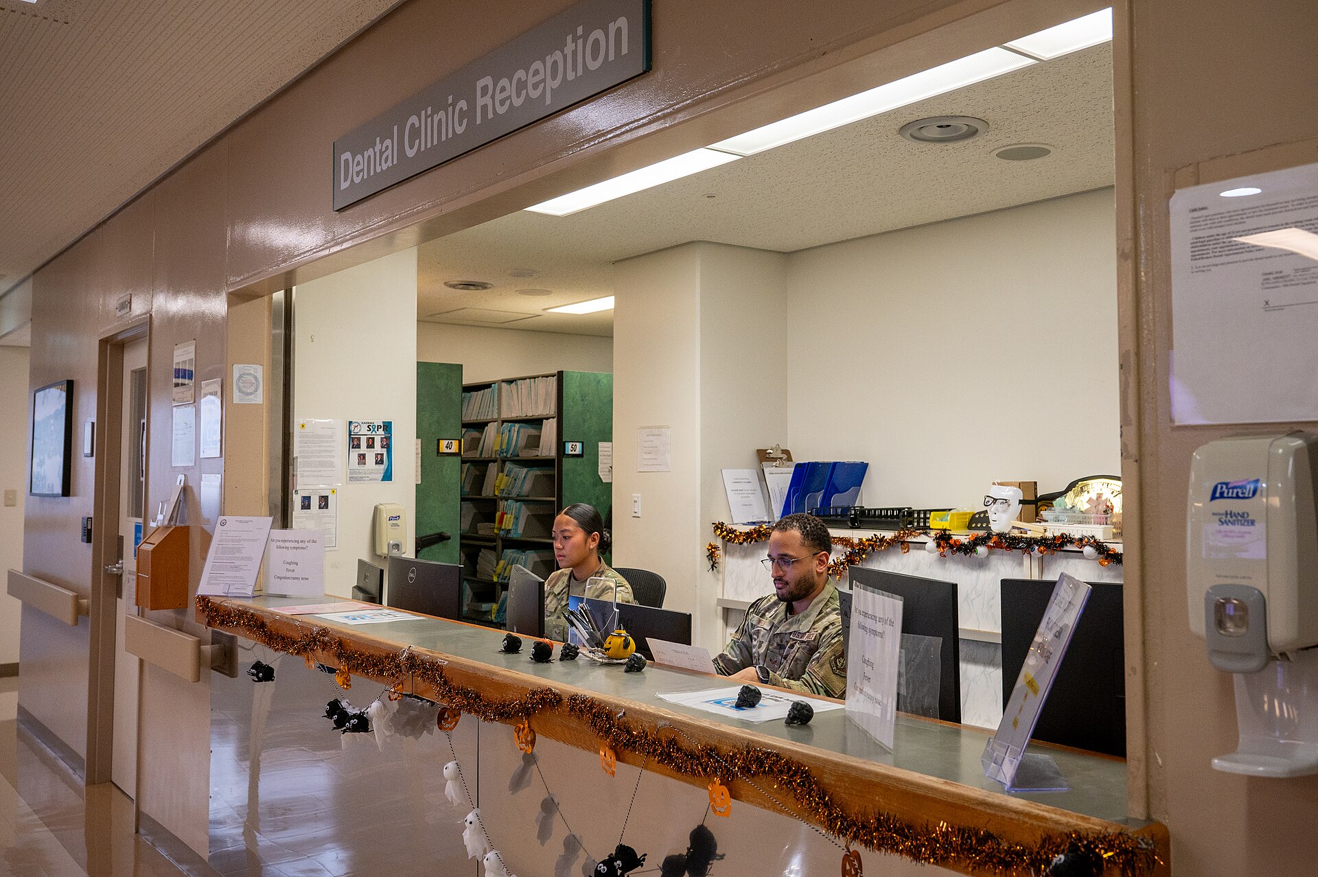 How Much Is Urgent Care Without Insurance? Real Prices 1 Patient checking in at an urgent care clinic reception desk